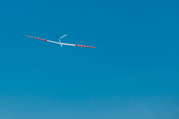 RC soaring plane on blue sky