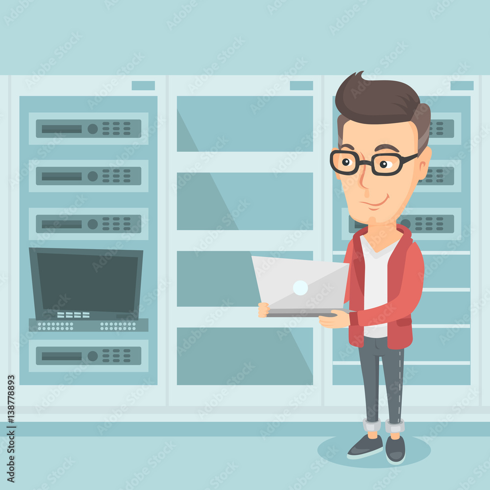 Poster engineer working on laptop in network server room.