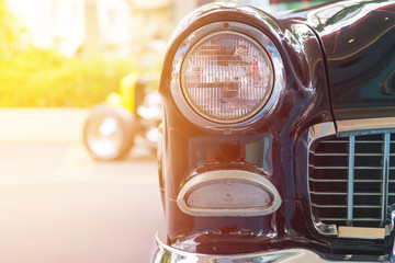 Classic car with close-up on headlights or Headlight lamp of retro  car vintage style