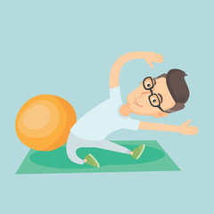 Young man exercising with fitball.