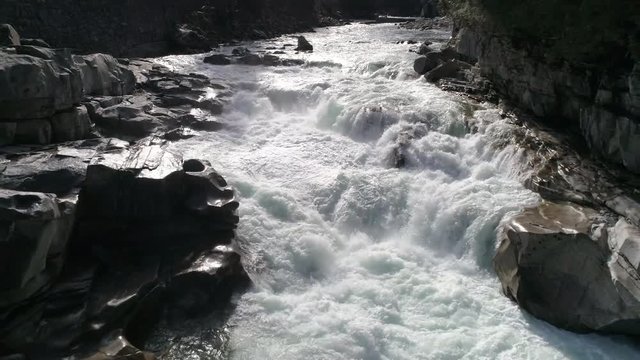 Drone Flying Over Stunning River Waterfall with White Water Rapids in Ultra Real 4K Nature Shot