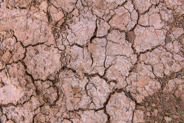 texture of red dry soil for brackground