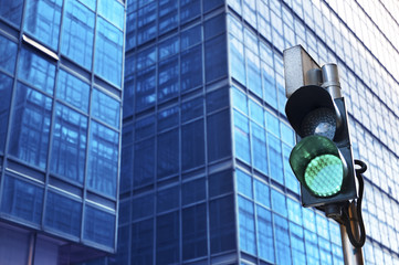 Traffic light with urban background