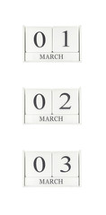 Closeup group of white wooden calendar with black 1 , 2 , 3 march word , three date calendar isolated on white background