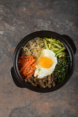 Bibimbap- Korean mixed rice with vegetables and meat served in a clay pot. 