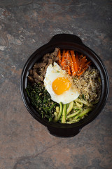 Bibimbap- Korean mixed rice with vegetables and meat served in a clay pot. 