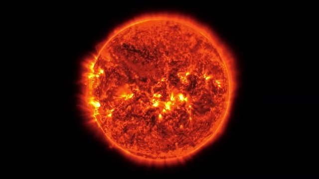 Loopable: Real sun surface with solar flares. The Sun spinning in space isolated on black background. Elements of this clip furnished by NASA. Cleaned, looped and color-graded.