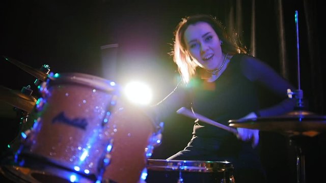 Passionate girl percussion drummer perform music break down - teen rock music, slow motion