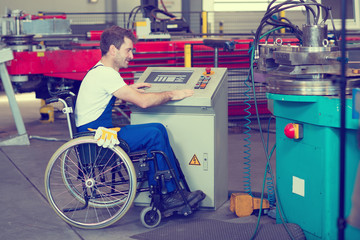 disabled worker in wheelchair in factory