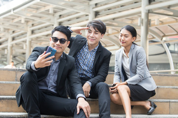 Asia business people or businessman and businesswoman selfie outdoor, Protrait business concept.