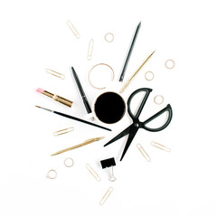 Home office workspace with coffee cup, scissors, clips and female accessories. Flat lay, top view