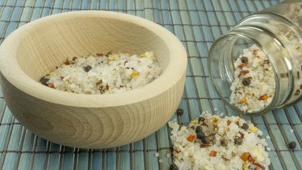 Steak salt in a wooden mortar on a wood background
