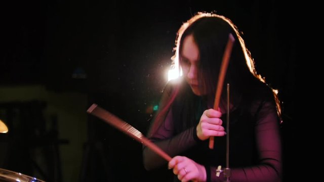 Teen rock music - passionate girl with long hair - percussion drummer perform music break down