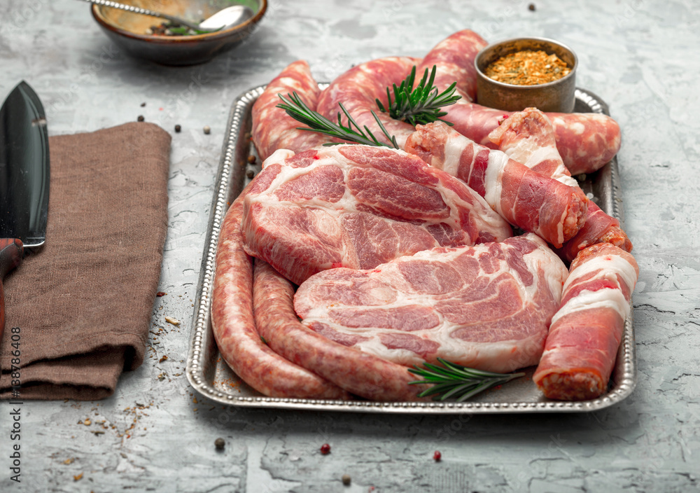 Wall mural Set of different meat products on a light surface