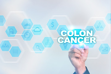 Medical doctor drawing colon cancer on the virtual screen.