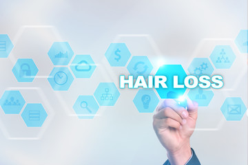 Medical doctor drawing hair loss on the virtual screen.