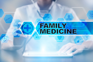 Medical doctor using tablet PC with family medicine medical concept.