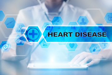 Medical doctor using tablet PC with heart disease medical concept.