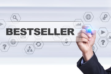 Businessman drawing on virtual screen. bestseller concept.