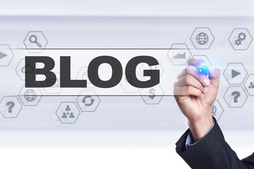 Businessman drawing on virtual screen. blog concept.