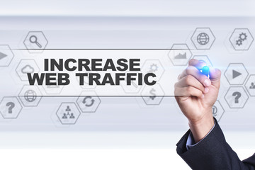 Businessman drawing on virtual screen. increase web traffic concept.