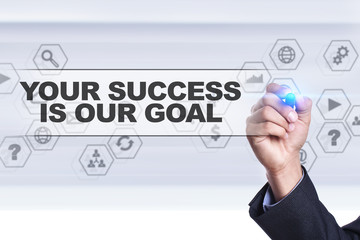 Businessman drawing on virtual screen. your success is our goal concept.