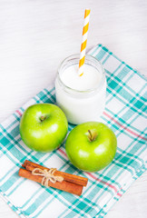 Useful snack, green apples and homemade yogurt with cinnamon.