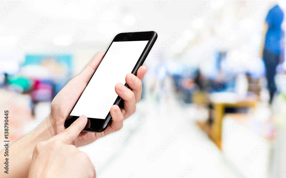 Aufkleber Hand click mobile phone with blur store background bokeh light,White screen mock up template for adding your design or your text