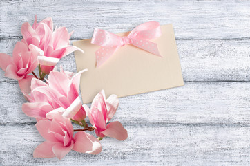 Magnolia flowers on background of shabby wooden planks