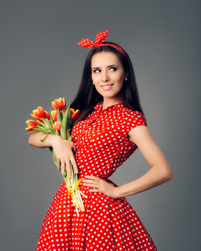 Cute Girl in Retro Red Polka Dress with Tulips