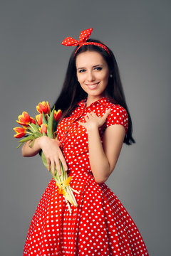 Cute Girl in Retro Red Polka Dress with Tulips