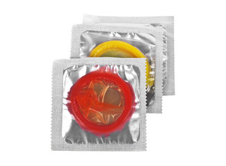 Close up of a colored condoms on white background