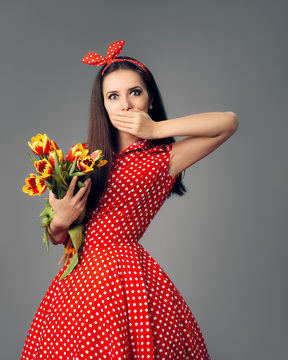 Surprised Girl in Retro Red Polka Dress with Tulips