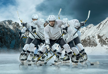 Ice hockey player in action outdoor around mountains