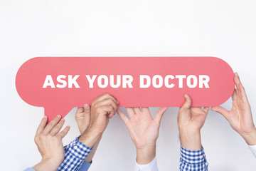 Group of people holding the ASK YOUR DOCTOR written speech bubble