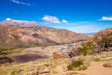 Obraz premium Argentina, Patagonia, El Chalten area. Trekking to the Laguna Capri and Fitz Roy Mountain. Landscape view to the river Rio de las Vueltas valley. Sky with the clouds.