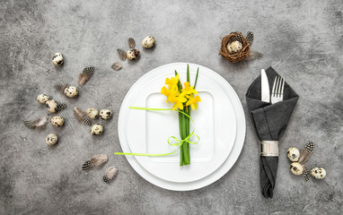 Easter table setting decoration eggs and flowers