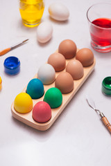 Fototapeta na wymiar Happy Easter! Friends painting Easter eggs on table.