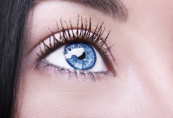 Fototapeta na wymiar A beautiful insightful look woman's eye. Close up shot