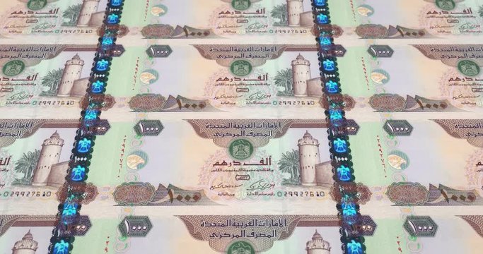 Banknotes of one thousand dirhams arabs rolling on screen, cash money, loop