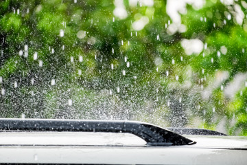 Raindrop falling on car