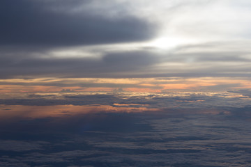 View of sunset and cloud from airplane