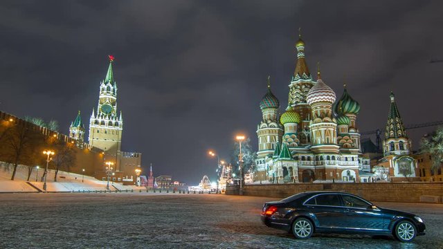 Moscow Kremlin timelapse hyperlapse with Spasskaya tower and Cathedral of St. Basil, Russia. Red Square in winter night