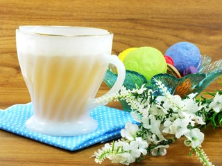 cup of tea with sweet and colorful french macaroons