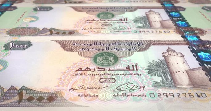 Banknotes of one thousand dirhams arabs rolling on screen, cash money, loop