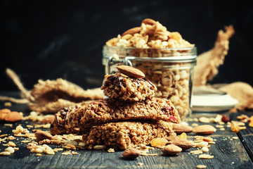 Cereal muesli bars, dark background, selective focus