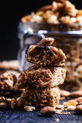 Cereal muesli bars, dark background, selective focus