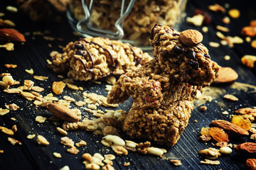 Cereal muesli bars, dark background, selective focus