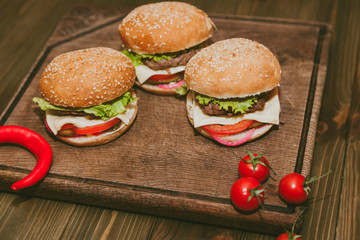 burgers, red peppers and tomatoes