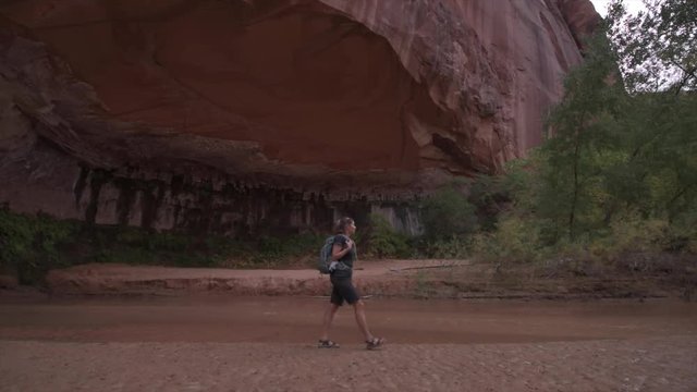 Backpacker Girl exploring Coyote Gulch Grand Staircase Escalante National Monument